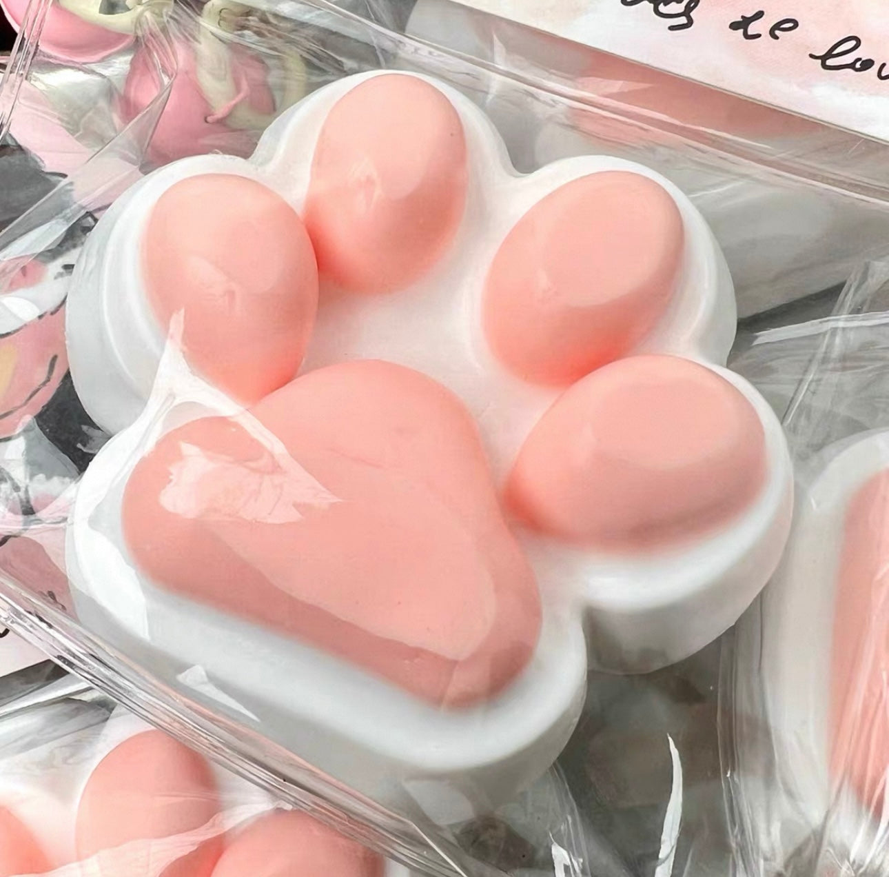 Squeeze the happy little cat paw