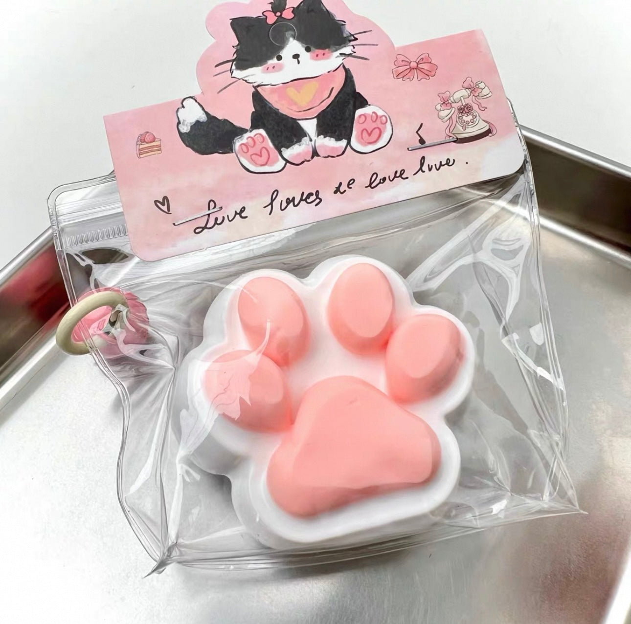 Squeeze the happy little cat paw