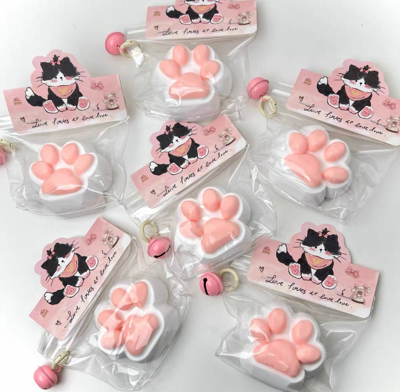 Squeeze the happy little cat paw